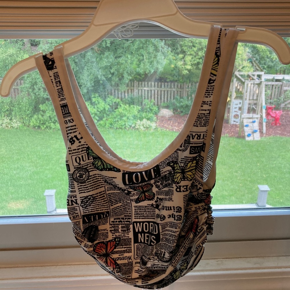 Adjustable news with butterfly tank